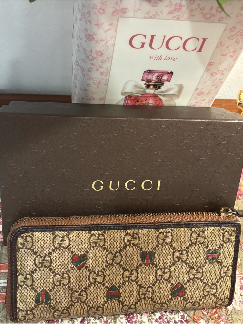 Gucci Beige GG Canvas Zip Wallet with Green and Red Heart Motifs.